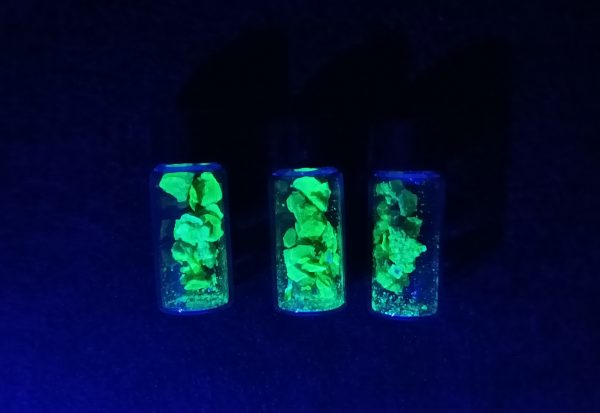 three vials in UV